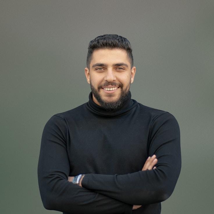 Alex Kim, Lead Design Curator at Mindful Life Balance, reviewing corporate floral arrangements